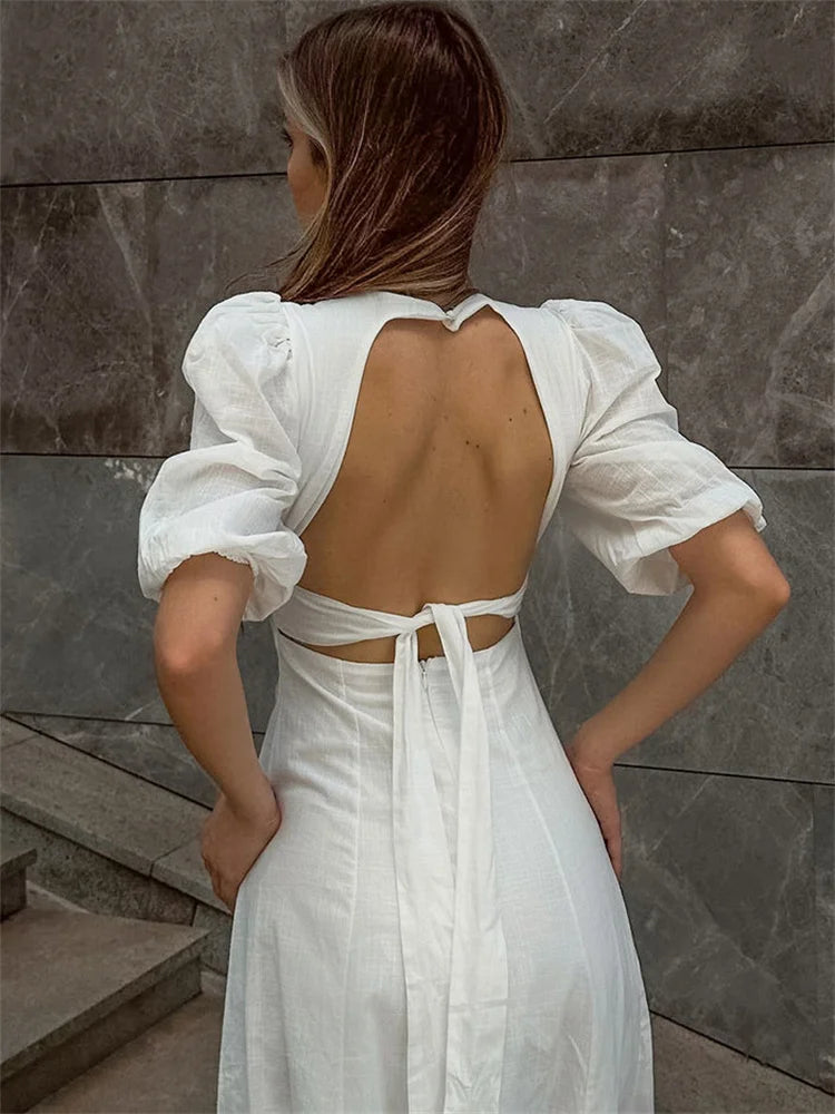 Close-up of tie-back open design on white summer dress