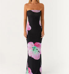 Close-up of black tube dress with purple flower print detail