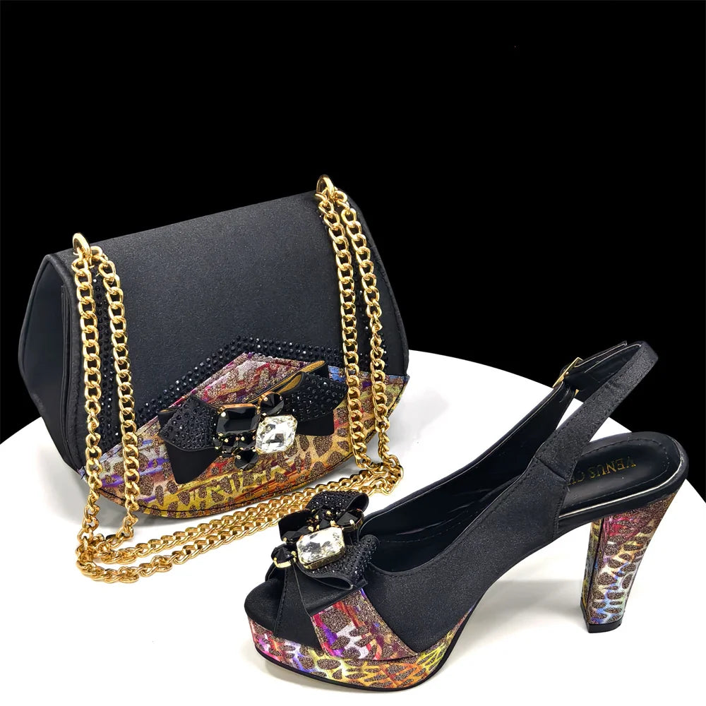 Close-up of floral rhinestone bow on heels and matching black handbag