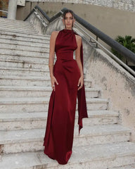 Close-up of satin halter dress showing backless design and fabric sheen