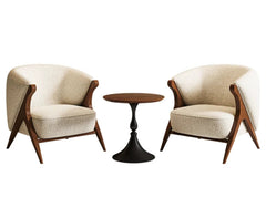 “Close-up of lamb wool upholstery and sculpted wooden frame”