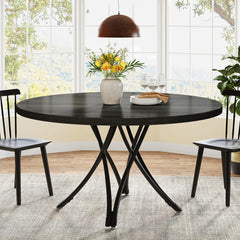 close-up of woodgrain tabletop and industrial-style pedestal base
