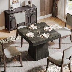 close-up of smooth wooden tabletop and sturdy pedestal base
