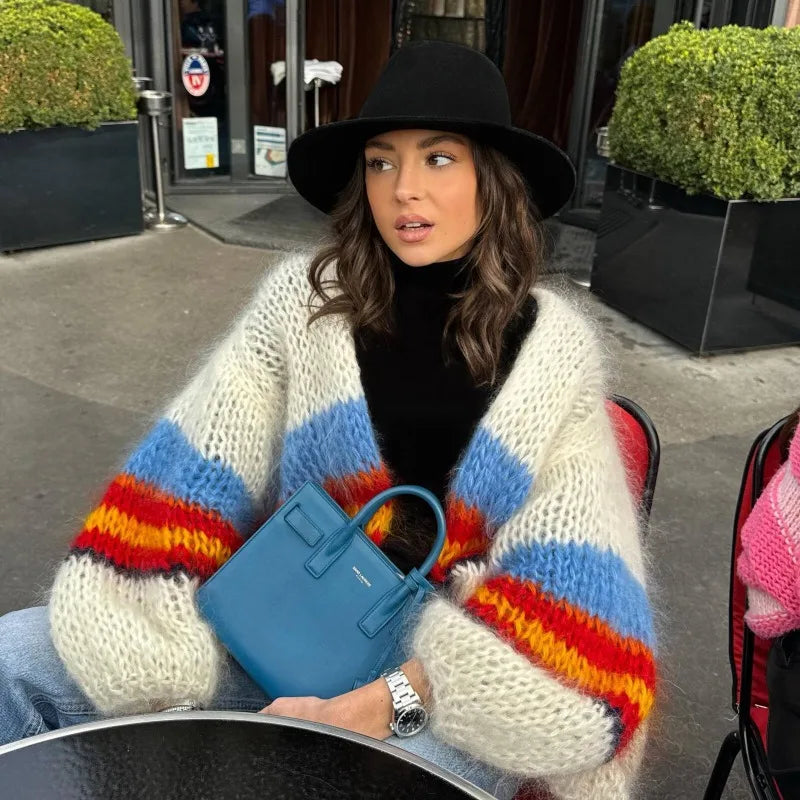 Colorful striped chunky knit open-stitch cardigan with blue bag