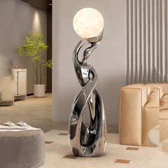 Contemporary black and gold lamp lighting a reading corner