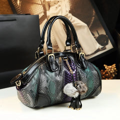 Contrast color cowhide dumpling purse with zipper closure