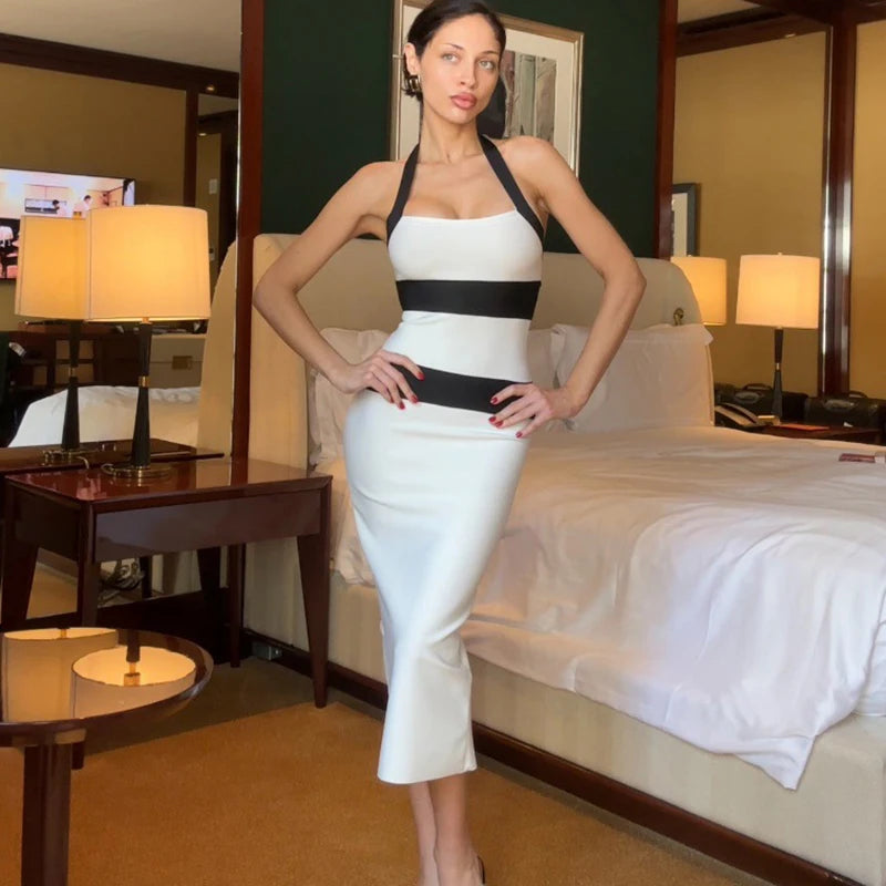 Black and white contrast halter midi dress styled for modern office looks
