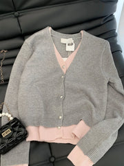 Pastel pink trim vneck cardigan styled for England school
