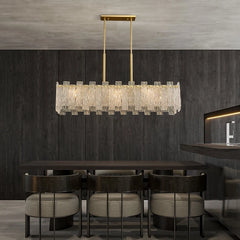 Copper linear crystal dining chandelier over a modern table