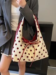 Coquette-style casual dot bag paired with modern basics