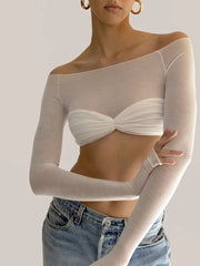 Close-up of knitted mesh slash neck blouse