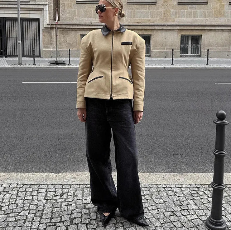 Structured zip jacket styled with denim for a polished casual look
