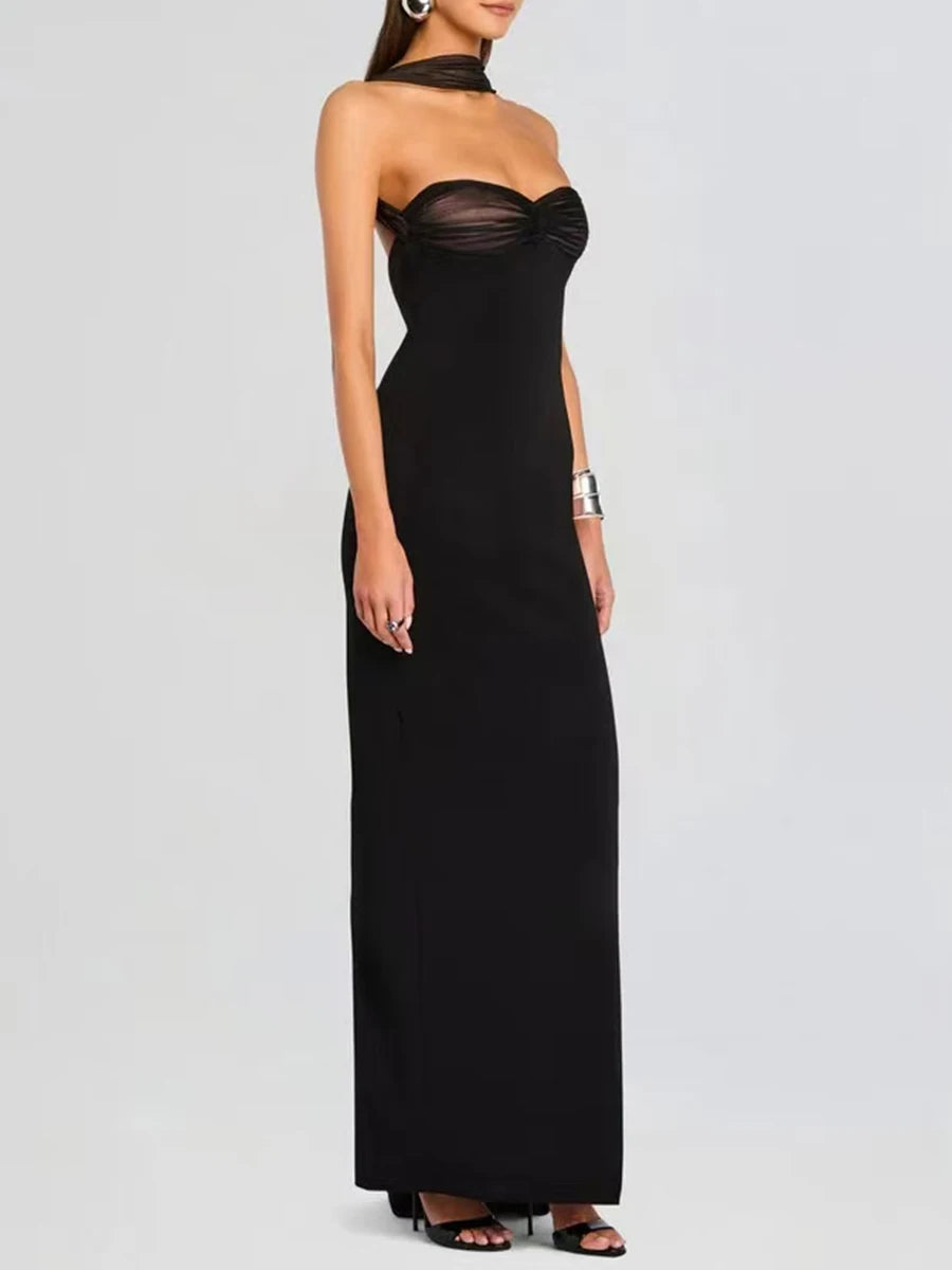 Lifestyle shot of a strapless evening dress featuring couture-inspired back folds for destination photography.