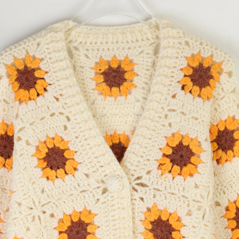 Cozy autumn cardigan for women shown on white background with textured detail