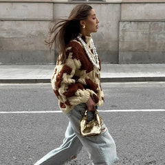 Cozy chunky knit sweater paired with denim for a statement fall look