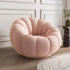soft round lounge chair placed in modern scandinavian bedroom
