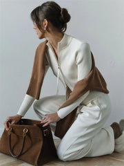 White knit cardigan with brown scarf and tote styled for commute
