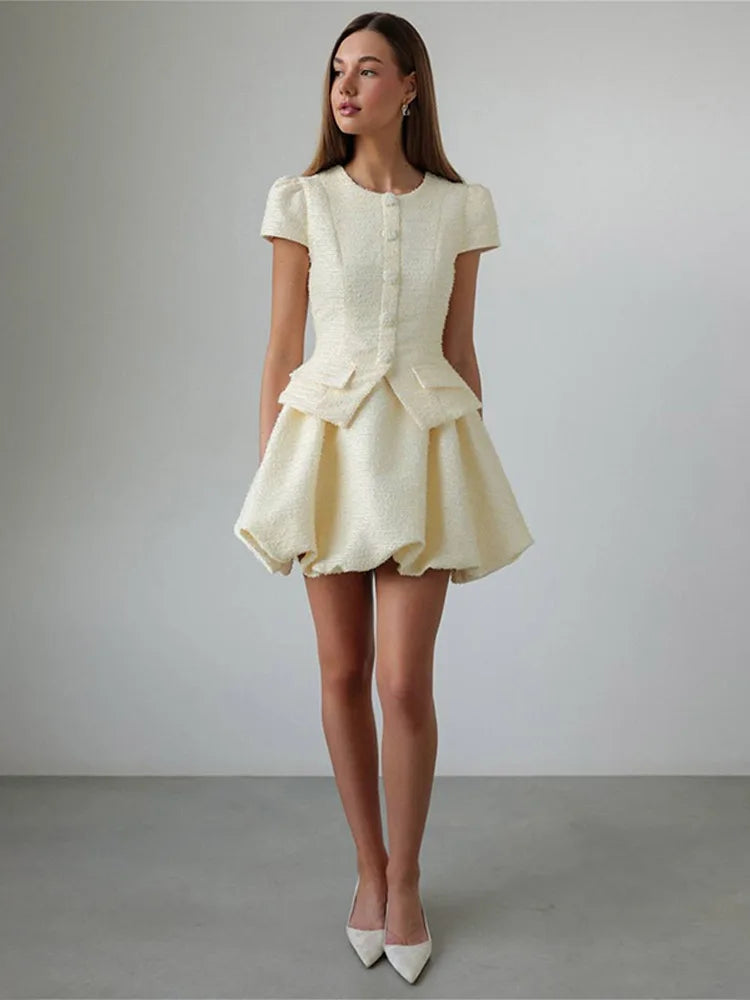 Full view highlighting the bubble mini skirt’s sculpted volume and textured weave, styled with the matching fitted top.