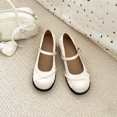 Pair of cream Mary Jane pumps with block heel