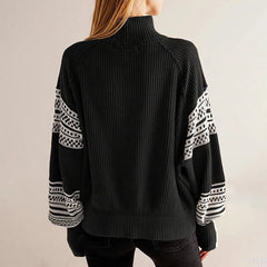 Detail view of the crew neckline and shoulder line, highlighting the ribbed trim and smooth knit texture for a polished look.