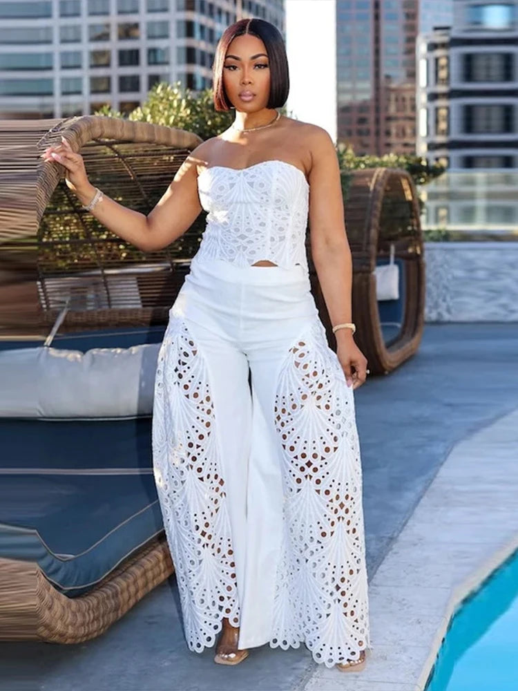 Close-up of crochet panel detail on white wide-leg trousers