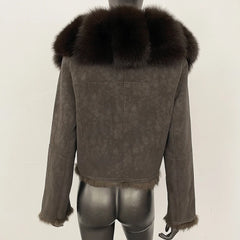 Short suede jacket shown straight on, emphasizing wide-waisted cut and clean cropped proportions