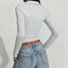 Back view highlighting the slim fit through the waist and long sleeve length.
