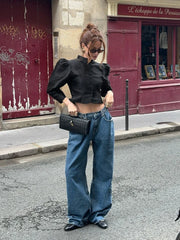 Front detail of a cropped jacket top with a clean structured shape