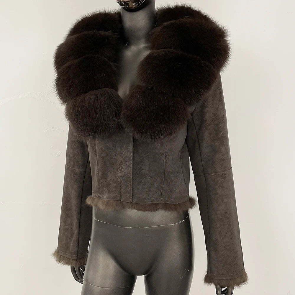 Cropped suede jacket with rich brown fur collar displayed front-facing on a mannequin against a neutral studio backdrop