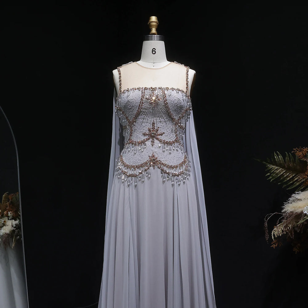 Close view of gold-toned beading and crystal detail on the bodice of a formal gown