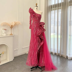 Pink evening gown on a mannequin in a room with a fireplace and curtains.