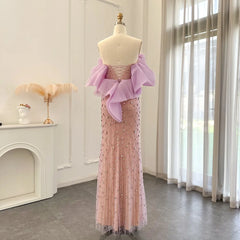 The crystal-embellished wedding party gown is styled for a formal event.