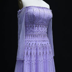Crystal pearl  lilac wedding guest dress in lilac formalwear with intricate beading on a black background