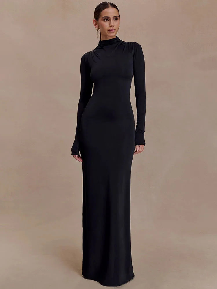 Full-length black evening dress with long sleeves and open back design