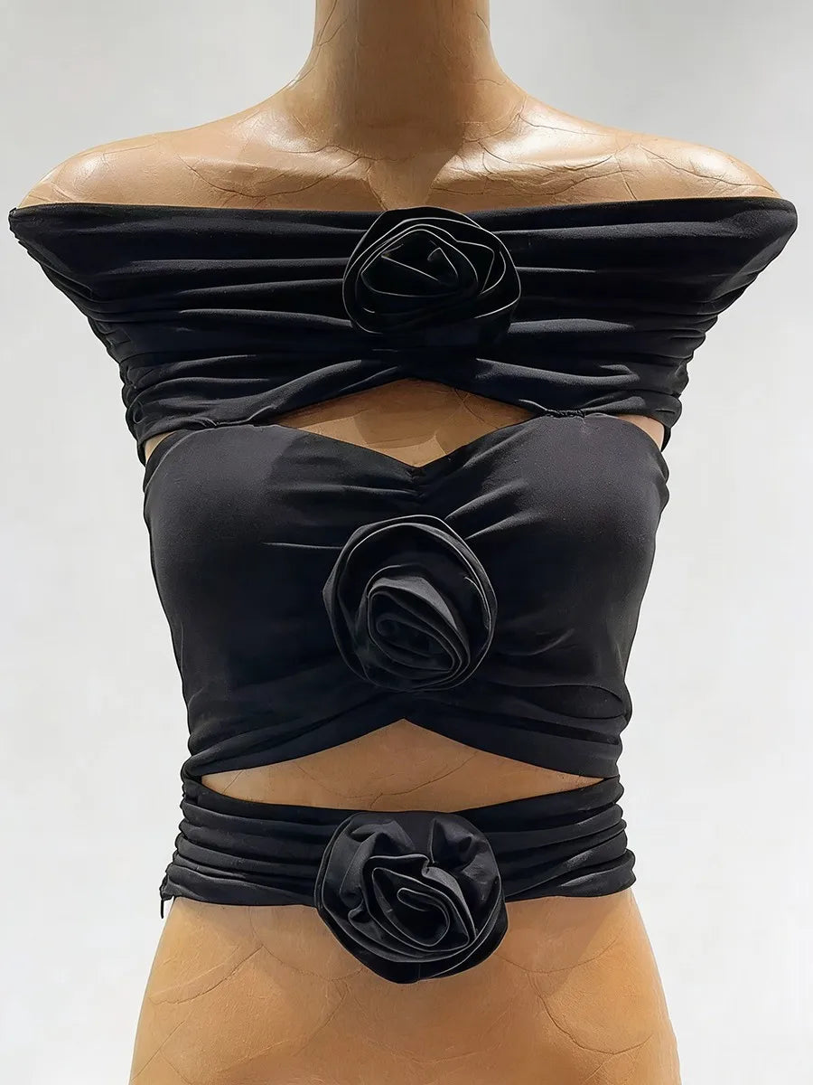 Cropped cutout top with a smooth fitted silhouette and floral appliqué detail