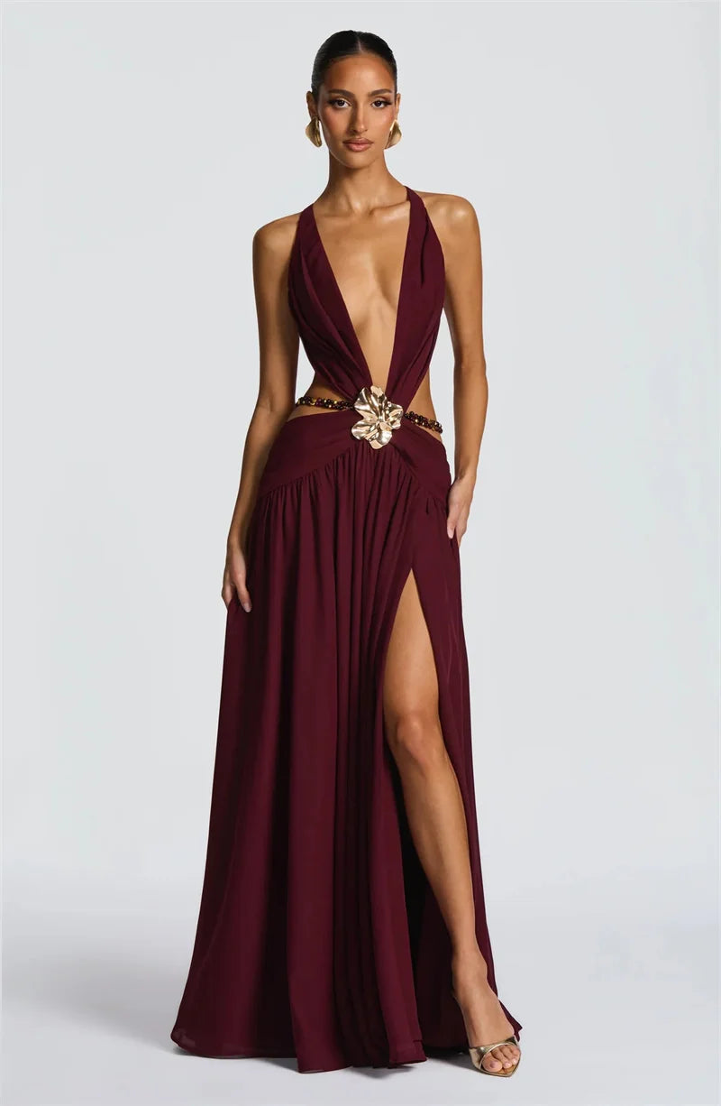 Full-length evening gown with cutout waist and flowing skirt
