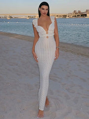 Woman wearing deep V-neck sleeveless knitted beach dress