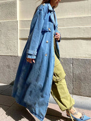 Oversized women’s denim trench coat street style look