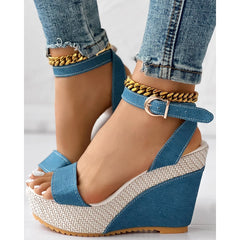 Blue denim ankle strap wedge sandals with buckle closure