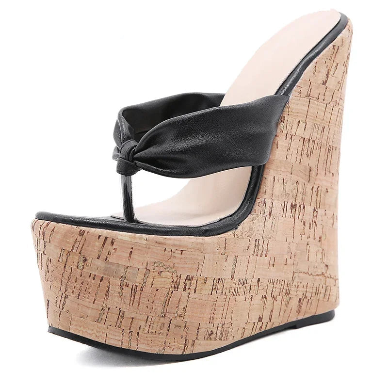 An elegant pair of designer mules with a high heel.