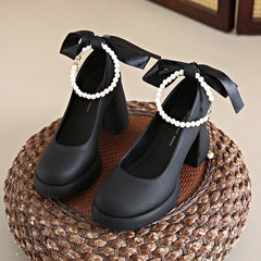 Black Mary Jane heels with pearl ankle strap
