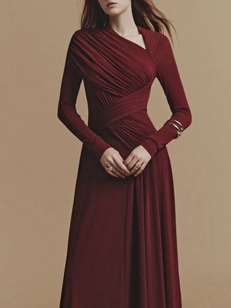 Long sleeve formal dress with diagonal collar and a flowing hemline