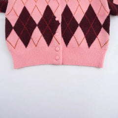 Close-up detail revealing the knit texture and layered diamond pattern across the fabric