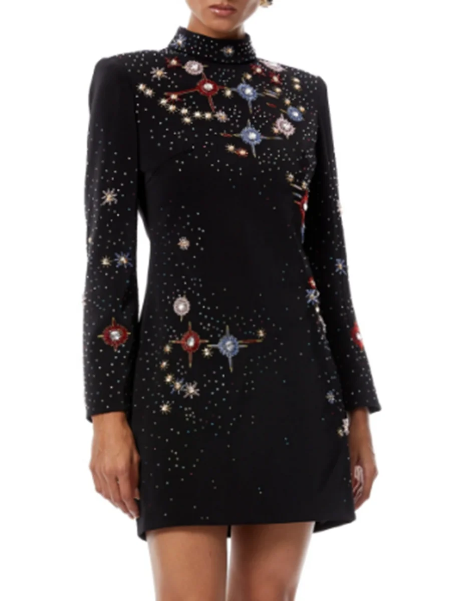 Tailored galaxy mini dress showing dramatic sleeve proportion and cinematic night styling