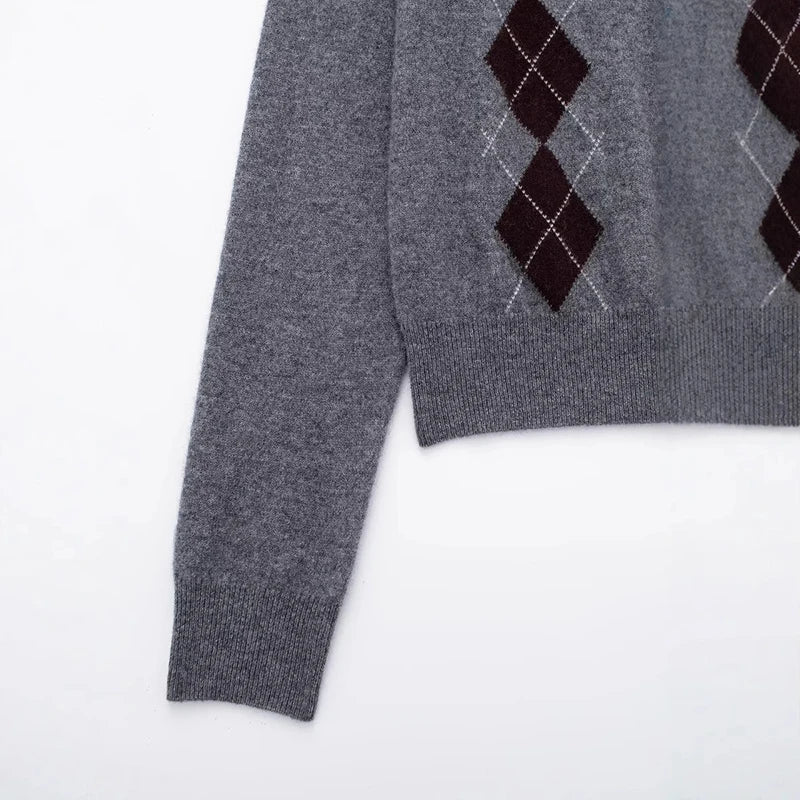 Gray sweater with argyle pattern on a white background