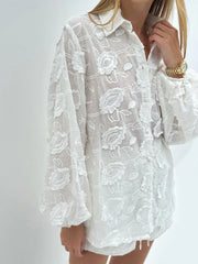 Dimensional embroidered shorts suit captured for summer and resort styling