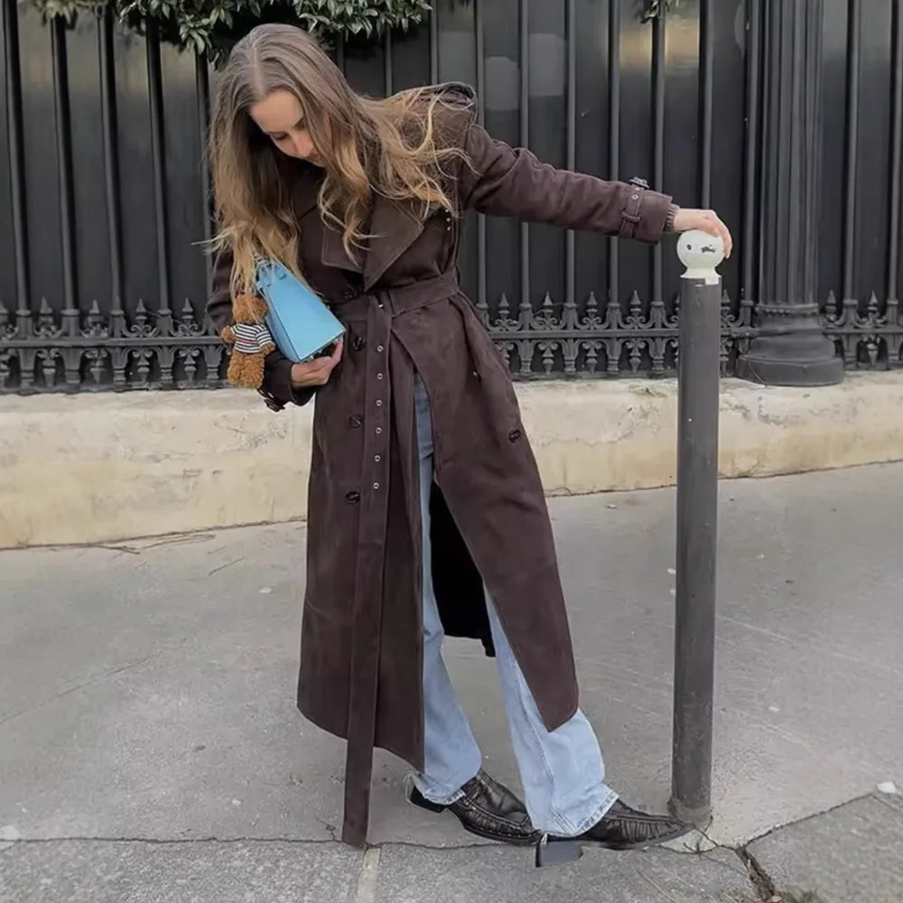 Close-up of double-breasted grey trench coat with structured collar