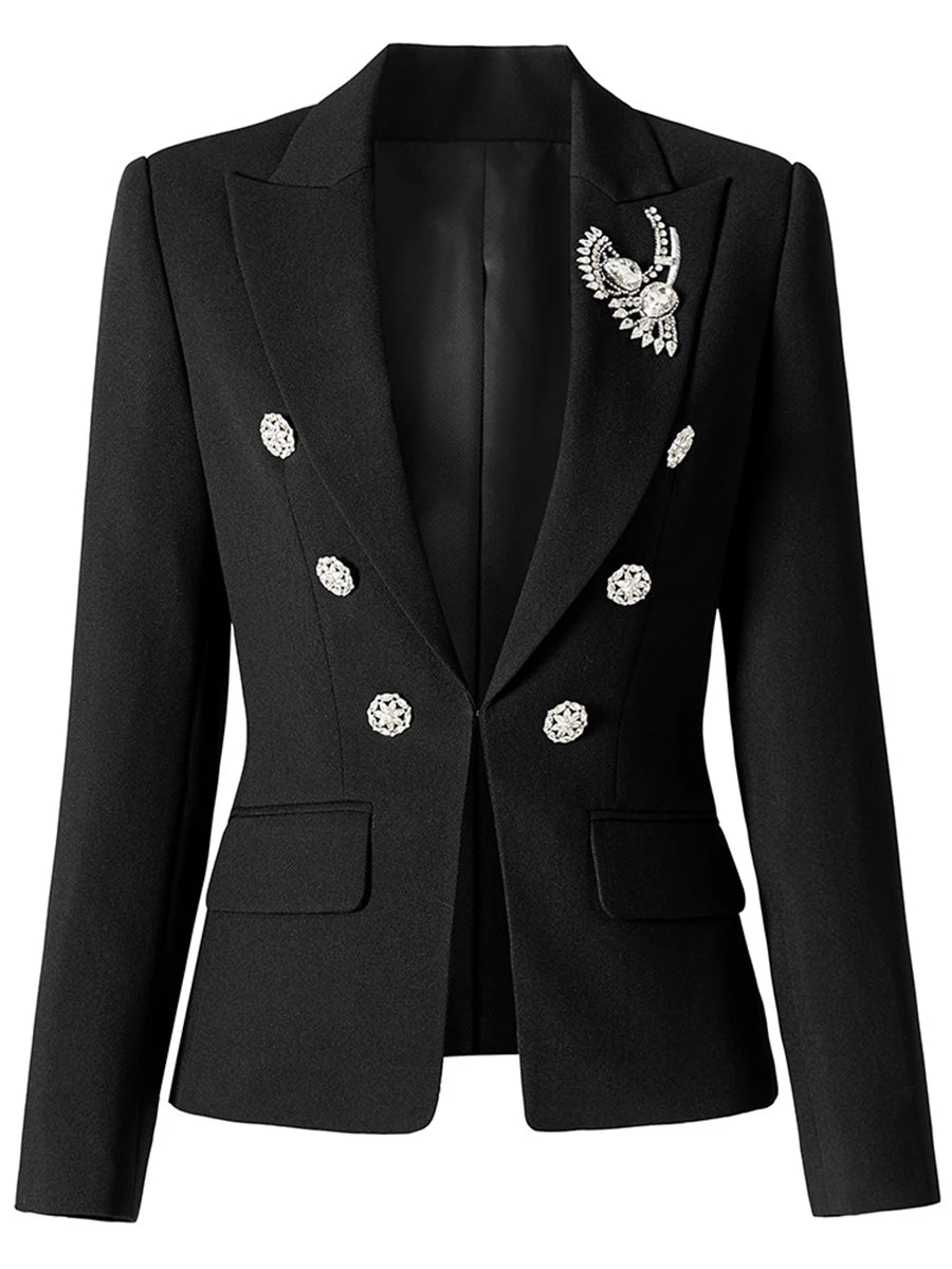 Close-up of the black blazer highlighting the diamond-style buttons and brooch detail on the lapel.