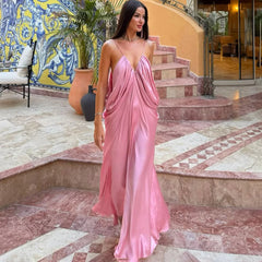 Draped pink sling maxi dress styled for summer resorts and parties