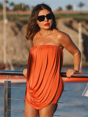 Close view of folded drape detail on strapless mini dress